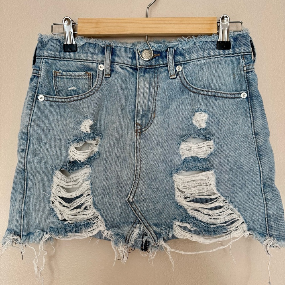 Distressed denim mini skirt